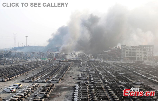 News cars are burnt down to their metal frames at a parking lot near the blast site in Tianjin municipality on August 13, 2015. Two massive explosions caused by flammable goods rocked an industrial area in the northeast Chinese port city late on Wednesday, killing at least 17 people and injuring more than 400. (Photo: China News Service/ Han Haidan)