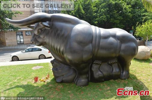 A bronze sculpture symbolizing a bull riding over a bear is installed at an art museum in Xiamen city, East China's Fujian province, Aug 24, 2015. The sculpture measures 6.1 meters long, 3.4 meters high, and 2.9 meters wide, and it weighs 3 tons. The owner of the sculpture said that he hopes frustrated stock investors, hit hard by the recent plunges despite government efforts, can feel relaxed and sleep well at night after looking at the sculpture. (Photo/CFP)