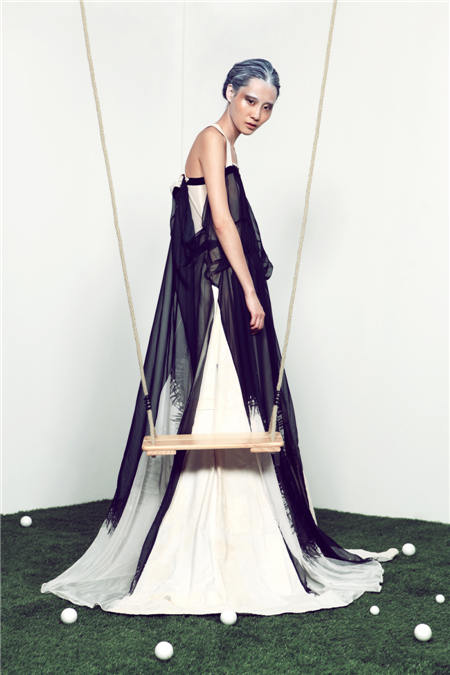 This dress is made from used clothes after cleaning, disinfection, tearing down, redesign and restructuring. Provided By Reclothing Bank