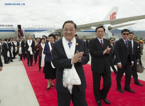 Yu Zhengsheng (front), chairman of the National Committee of the Chinese People's Political Consultative Conference (CPPCC), arrives in Lhasa, capital of southwest China's Tibet Autonomous Region, Sept. 6, 2015, leading a central government delegation to attend festivities marking the 50th anniversary of the region's founding. (Xinhua/Xie Huanchi)