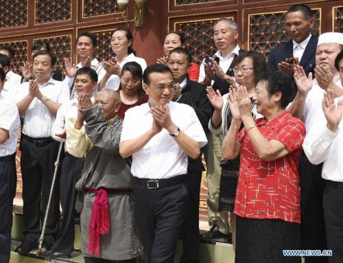 Chinese Premier Li Keqiang (C front) meets with national model teachers and teachers working in rural areas ahead of the 31st Teachers' Day which falls on Sept. 10 in Beijing, capital of China, Sept. 8, 2015. (Photo: Xinhua/Li Xueren)