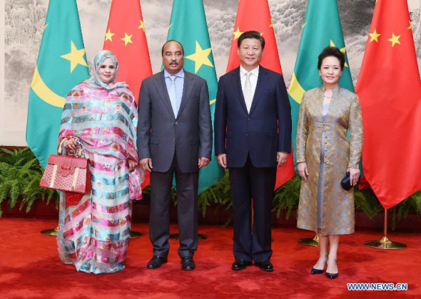 Chinese President Xi Jinping (2nd R) and his wife Peng Liyuan (1st R) pose for a group photo with Mauritanian President Mohamed Ould Abdel Aziz (2nd L) and his wife at the Great Hall of the People in Beijing, capital of China, Sept. 14, 2015. (Photo: Xinhua/Yao Dawei)