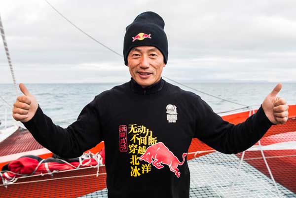 Chinese skipper Guo Chuan celebrates onboard the Qingdao China after finishing a nonstop voyage through the Arctic Ocean. (Photo provided to chinadaily.com.cn)
