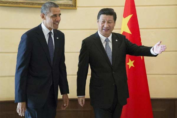 Chinese President Xi Jinping (R) meets with US President Barack Obama in St. Petersburg, Russia, Sept 6, 2013. (Photo/Xinhua)