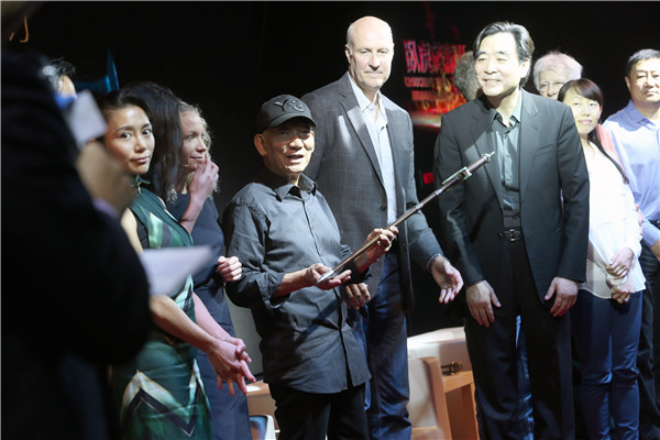 Hong Kong veteran filmmaker Yuen Woo-ping with the promotional team for Crouching Tiger, Hidden Dragon II: The Green Legend at an event in Beijing. (Photo provided to China Daily)