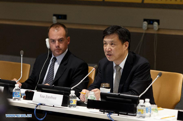 You Jianhua (R), secretary-general of China NGO Network for International Exchanges (CNIE), speaks during a round-table meeting titled Balance and Sustainability: Role of China NGOs in the Global Development Agenda at the UN Headquarters in New York and submitted a proposal at the UN headquarters in New York, Sept. 18, 2015. A Chinese non-governmental organization association submitted a proposal to the United Nations on Friday, vowing to work with other NGOs in realizing sustainable development agenda. (Xinhua/Li Muzi)