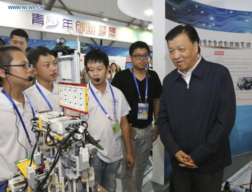 Liu Yunshan (1st R), a member of the Standing Committee of the Political Bureau of the Communist Party of China (CPC) Central Committee, attends a event marking the national popular science day, in Beijing, capital of China, Sept. 19, 2015. (Xinhua/Ding Lin)