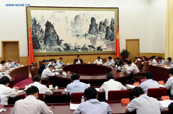 Liu Yunshan(rear C), a member of the Standing Committee of the Political Bureau of the Communist Party of China (CPC) Central Committee, attends a symposium on three stricts and three earnests, a series of requirements for officials to improve their lifestyles and work, in Beijing, capital of China, Sept. 21, 2015. (Photo: Xinhua/Rao Aimin)