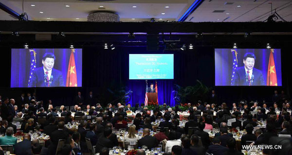 Chinese President Xi Jinping (C) delivers a speech during a welcome banquet jointly hosted by Washington State government and friendly communities in Seattle, the United States, Sept 22, 2015. Xi arrived in this east Pacific coast city on Tuesday morning for his first state visit to the U.S. (Photo/Xinhua)