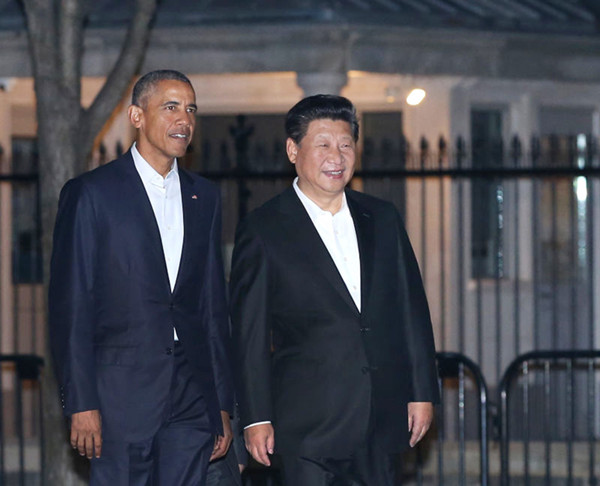 U.S. President Barack Obama (L) chats with Chinese President Xi Jinping as they walk from the West Wing of the White House to a private dinner across the street at Blair House, in Washington, September 24, 2015. (Photo provided to chinadaily.com.cn)