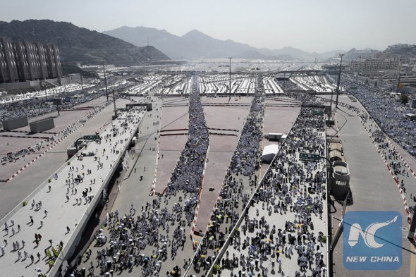 Muslim pilgrims arrive to throw pebbles at pillars during the Jamarat ritual, the stoning of Satan, in Mina near the holy city of Mecca, on September 24, 2015. (Xinhua photo)