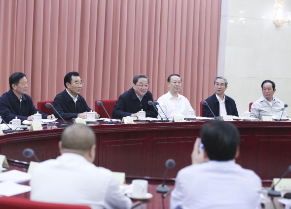 Yu Zhengsheng (3rd L rear), chairman of the National Committee of the Chinese People's Political Consultative Conference (CPPCC), presides over a bi-weekly consultation session of the CPPCC on poverty alleviation, in Beijing, capital of China, Sept. 24, 2015. (Photo: Xinhua/Ding Lin)