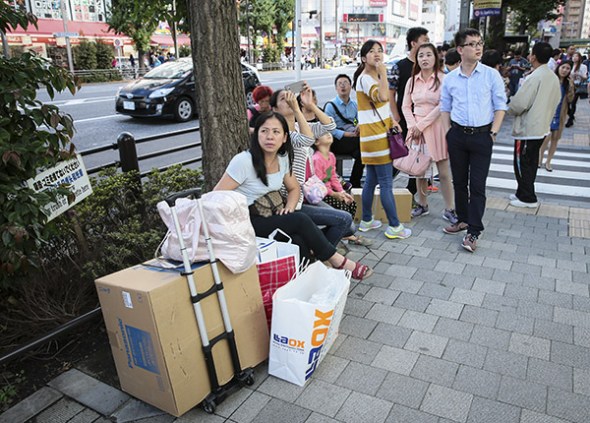 Chinese shoppers in the Akihabara electronics shopping district in Tokyo on Friday. (Photo/China Daily)