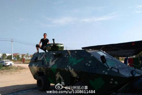Shi poses with his armored car. (Photo/Sina Weibo)
