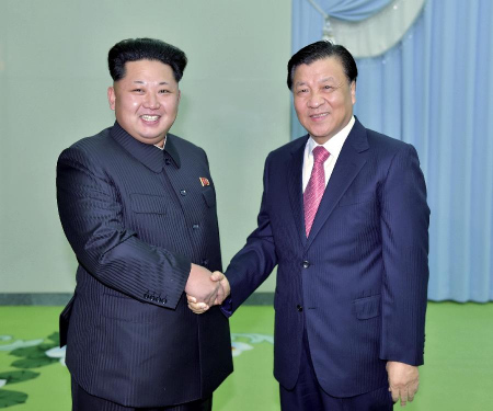 Liu Yunshan (R), a member of the Standing Committee of the Political Bureau of the Communist Party of China Central Committee, meets with Kim Jong Un, first secretary of the DPRK's ruling Workers' Party of Korea, in Pyongyang, the Democratic People's Republic of Korea, on Oct. 9, 2015. (Photo: Xinhua/Li Tao)