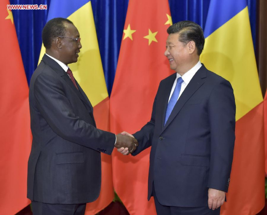 Chinese President Xi Jinping shakes hands with Chadian President Idriss Deby at the Great Hall of the People in Beijing, China, Oct. 15, 2015. (Photo: Xinhua/Li Tao)