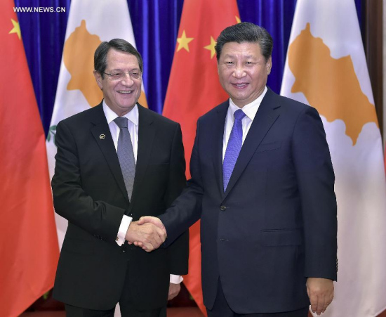 Chinese PresidentXi Jinpingshakes hands with Cypriot President Nicos Anastasiades at the Great Hall of the People in Beijing, China, Oct. 15, 2015. (Photo: Xinhua/Li Tao)