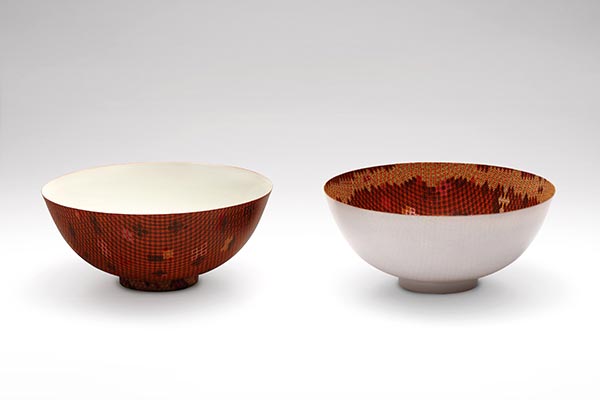 A pair of red enamel porcelain bowls will be under the hammer at Christie's auction on Saturday. (Photo provided to China Daily)