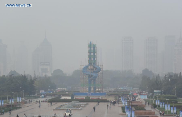 Ji'nan, capital of east China's Shangdong Province, is shrouded with smog on Oct. 20, 2015. (Photo: Xinhua/Zhu Zheng)