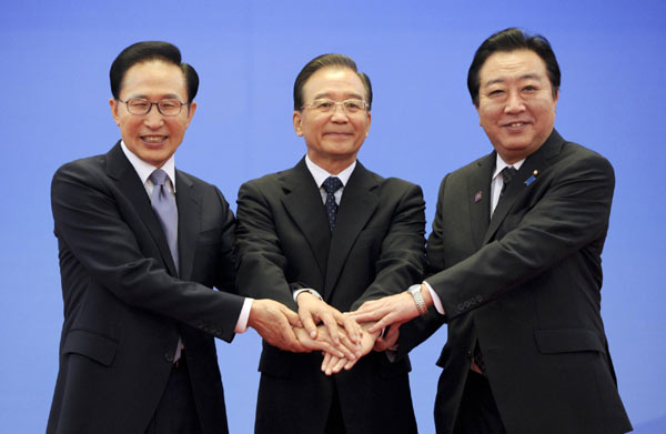Then President of the Republic of Korea Lee Myung-bak (left), then Premier Wen Jiabao (center), and then Japanese Prime Minister Yoshihiko Noda (right) pose for a group photo during the 5th China-Japan-ROK trilateral summit at the Great Hall of the People in Beijing, May 13, 2012. (Photo/Xinhua)