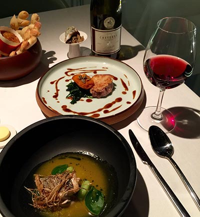 Sea bass in passionfruit sauce (front) and pork tenderloin in a crispy garlic crust are two current offerings on the mix-and-match menu. (Photo:China Daily/Mike Peters)