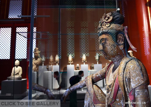 Photo taken on Oct. 8, 2015 shows a Buddha statue at the new exhibition area which is about to open to public at the Palace Museum in Beijing, captial of China, Oct. 8, 2015. (Photo: Xinhua/Jin Liangkuai)