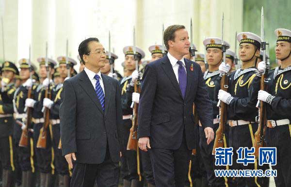 British Prime Minister David Cameron is welcomed by then Premier Wen Jiabao after arriving Beijing for state visit, Nov 9, 2010. (Photo/Xinhua)