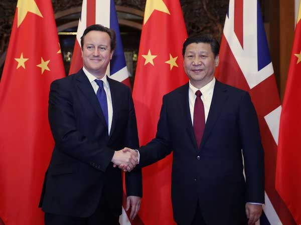 President Xi Jinping shakes hands with visiting British Prime Minister David Cameron in Beijing, on Dec 2, 2013. (Photo/Xinhua)