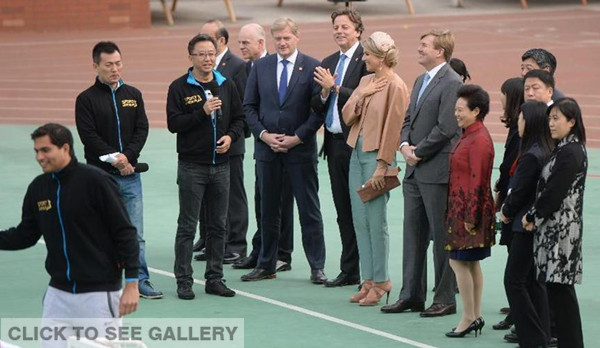 Dutch King Willem-Alexander and Queen Maxima talk as they attend the Sport 8 International Soccer Demonstration Class at Shijia Primary School in Beijing, China, on Oct. 25, 2015. (Photo: Xinhua/Li Jundong)