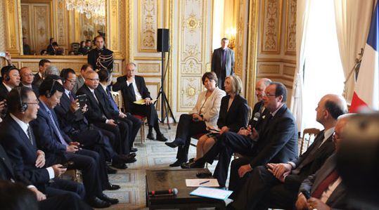 At the meeting of a visiting Chinese Entrepreneurs Club delegation in France in June 2013, Hollande promised to ensure more safety for Chinese tourists. (Photo/CNTV)