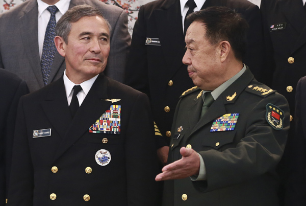 Fan Changlong (right), vice-chairman of the Central Military Commission, meets with Admiral Harry Harris, commander of the US Pacific Command, on Tuesday in Beijing. Fan expressed the hope that the two sides could build further trust. (Photo: China Daily/Feng Yongbin)