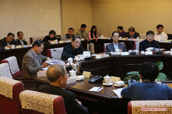 Yu Zhengsheng, chairman of the National Committee of the Chinese People's Political Consultative Conference (CPPCC), joins a group discussion of the 13th session of the Standing Committee of 12th CPPCC National Committee in Beijing, capital of China, Nov. 6, 2015. (Xinhua/Liu Weibing)