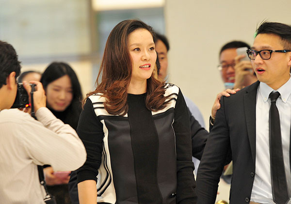 China's two-time Grand Slam winner Li Na attends a brand promotion in Hangzhou, Zhejiang province, in October after her retirement last year and her daughter's birth in June. (Photo/China Daily)