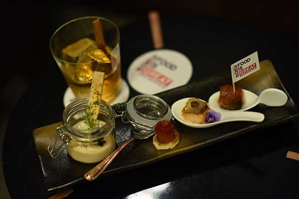 Savory bites prepared by chef Daniel Jia were matched with Johnny Walker's color-coded brands at a British Menu Week tasting.(Photo provided to China Daily)