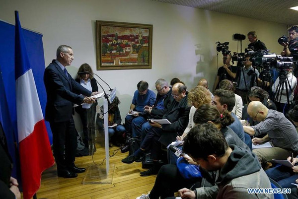 Paris Prosecutor Francois Molins (L) attends a press conference on the Friday Paris attacks in Paris, France, Nov. 14, 2015. The provisional death toll of Paris attacks is 129 and 352 injured, among whom at least 99 in very critical situations, Paris Prosecutor Francois Molins announced Saturday evening. (Photo: Xinhua/Zhou Lei)