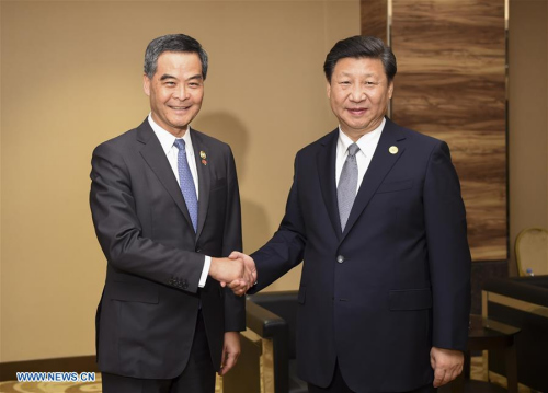 Chinese President Xi Jinping (R) meets with Chief Executive of China's Hong Kong Special Administrative Region Leung Chun-ying on the sidelines of the Asia-Pacific Economic Cooperation (APEC) Economic Leaders' Meeting in Manila, the Philippines, Nov. 18, 2015. (Xinhua/Xie Huanchi)