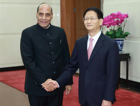 Meng Jianzhu (R), head of the Commission for Political and Legal Affairs of the Communist Party of China Central Committee, shakes hands with Indian Home Affairs Minister Rajnath Singh in Beijing, China, Nov. 20, 2015. (Xinhua/Ding Haitao) 