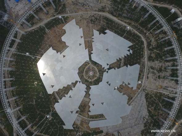 The feed cabin supporting system of China's single-aperture spherical telescope FAST is under test in Qiannan of southwest China's Guizhou Province, Nov. 21, 2015. When it is completed in 2016, the five hundred meter aperture spherical telescope (FAST) will be the world's largest, overtaking Puerto Rico's Arecibo Observatory, which is 300 meters in diameter. (Photo: Xinhua/Jin Liwang)