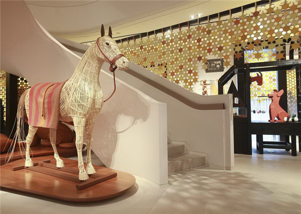 Pascale Mussard has run an in-house unit for reusing materials that were among waste at Hermes to create works including furniture, accessories and toys. (Photo provided to China Daily)