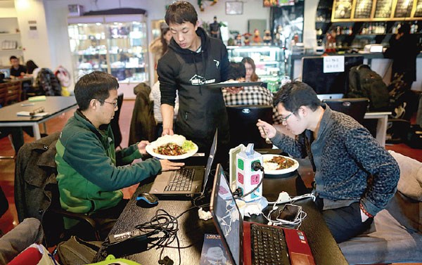 Young people at a cafe popular among start-up entrepreneurs in Zhongguancun, Beijing. Feng Yongbin / China Daily