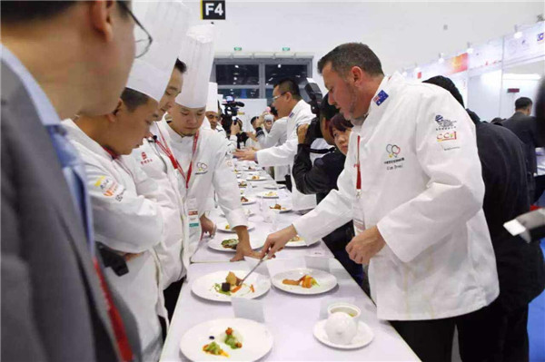 Chefs from around the world present their dishes to compete during the Chinese Cuisine World Championship. (Photo provided to China Daily)