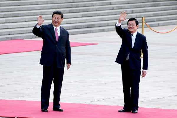 President Xi Jinping welcomes Truong Tan Sang in Beijing. (Photo by Wu Zhiyi / China Daily)
