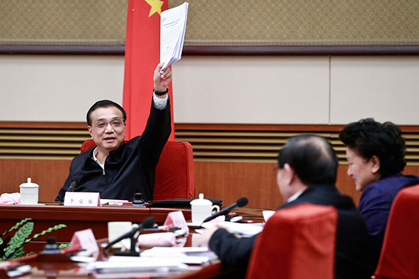 Premier Li Keqiang at a meeting on the country's educational strategy during the 13th Five-Year Plan (2016-20) in Beijing on Thursday. FENG YONGBIN/CHINA DAILY
