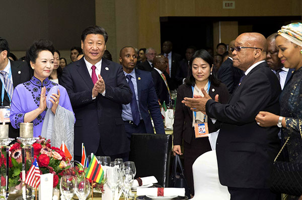 President Xi Jinping and his wife Peng Liyuan attend the welcoming banquet for the leaders participating in the second summit of the Forum on China-Africa Cooperation in Johannesburg on Thursday. HUANG JINGWEN/XINHUA