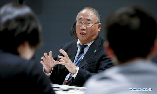 China's Special Envoy on Climate Change Xie Zhenhua speaks to media at the venue of Paris Climate Change Conference at Le Bourget on the northern suburbs of Paris, France, Dec. 9, 2015. (Xinhua/Zhou Lei)