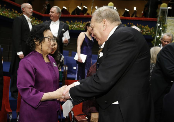 2015's Nobel laureate in Physiology or Medicine Tu Youyou (L) is congratulated following the Nobel Prize award ceremony at the Concert Hall in Stockholm, capital of Sweden, Dec. 10, 2015. (Photo: Xinhua/Ye Pingfan)