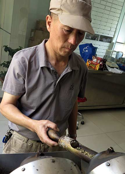 Zu Zhide, chief coofee taster of Yunnan Coffee Factory in Kunming, Yunnan province.