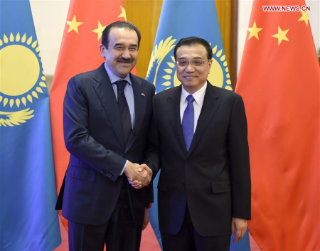 Chinese Premier Li Keqiang (R) holds talks with Kazakhstan's Prime Minister Karim Masimov in Beijing, capital of China, Dec. 14, 2015. (Photo: Xinhua/Zhang Duo)