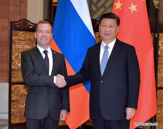 Chinese President Xi Jinping (R) meets with Russian Prime Minister Dmitry Medvedev in Wuzhen, east China's Zhejiang Province, Dec. 15, 2015. (Photo: Xinhua/Li Tao)