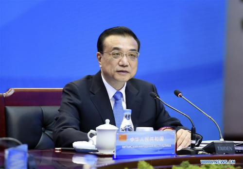 Chinese Premier Li Keqiang presides over the 14th prime ministers' meeting of the Shanghai Cooperation Organization (SCO) in Zhengzhou, capital of central China's Henan Province, Dec. 15, 2015. (Xinhua/Xie Huanchi)